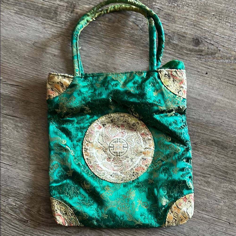 Emerald Green Tote Bag With Shimmery Fabric And Decorative Emblem